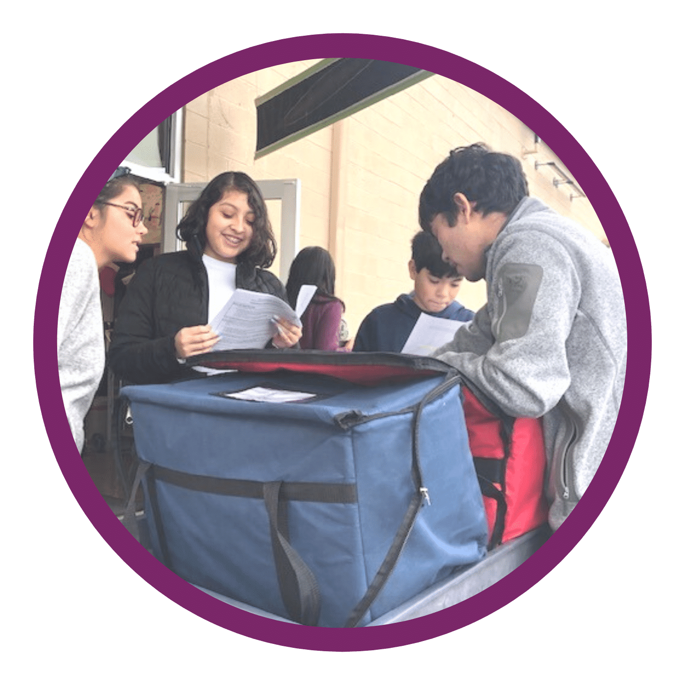 teens handing out food for global awareness